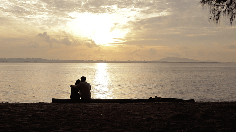 couple sunset beach