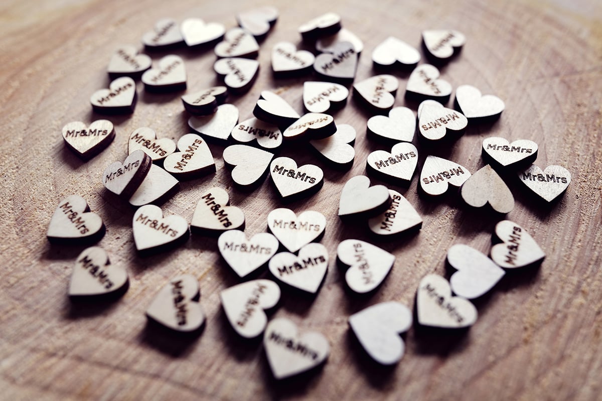 Mr and Mrs wedding decoration hearts on a wooden table